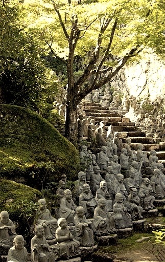 Small Buddha Statues line the stairs at Daisho-in temple, Miyajima, Japan