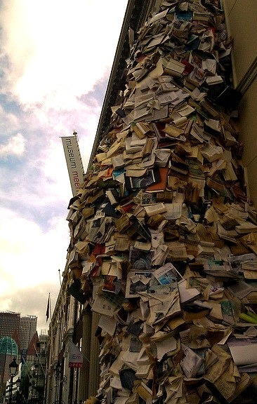 Books cascading from a window at Museum Meermanno  House of the Book in The Hague, Netherlands